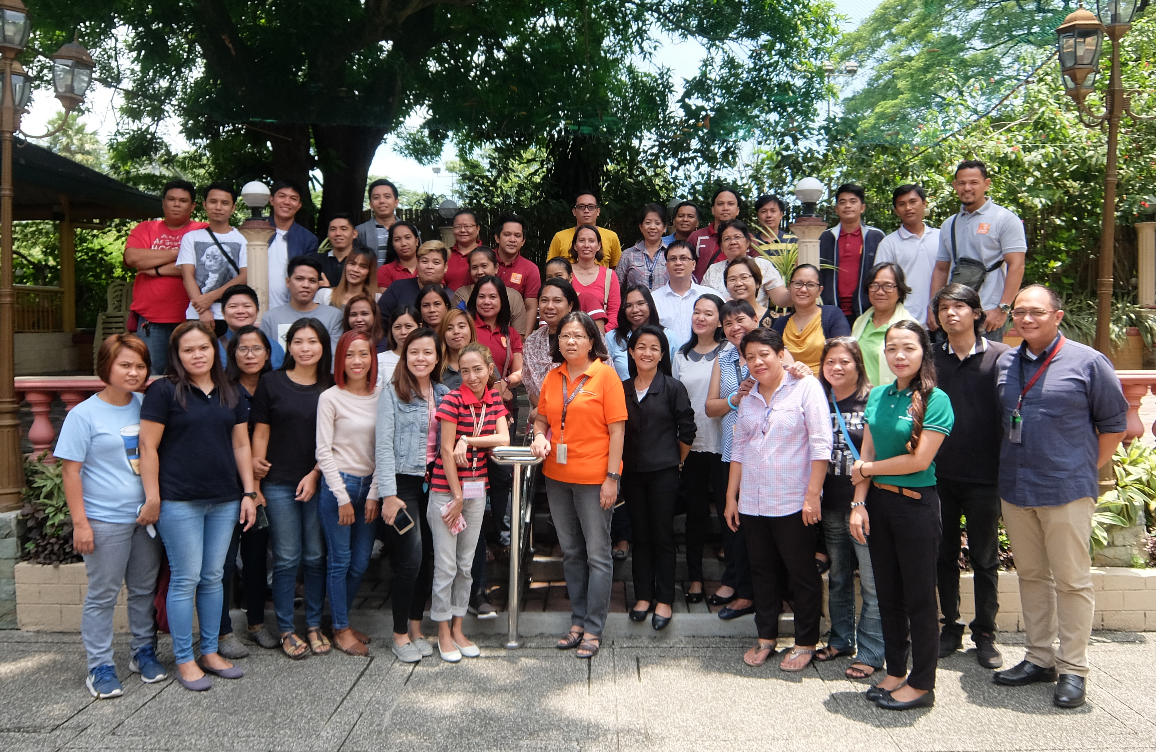 NMS field workers for the National Capital Region pose with, among others, their trainors UPPI Director Maria Midea M. Kabamalan (center) and Ms. Joy P. Cruz (center, second row) during their training in [Quezon City, Metro Manila; June 2018]